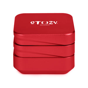 STEEZY® 4+1 | High Class Grinder | 63mm | 4-teilig Kräutermühle | quadratisch | CNC-gefräste Aluminiumlegierung | Neodym Magnetverschluss | Inklusive Pinsel & Klopfband "Amsterdam Red"