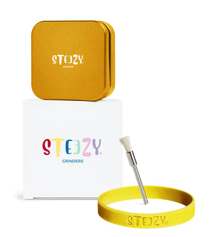 STEEZY® Pocket | High-Class Grinder | 55mm | 2-piece herb grinder | Square | CNC-machined aluminum alloy | Neodymium magnetic closure | Includes brush & tapping band "Sunset Gold"